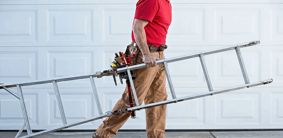 Garage door repair technician arriving with tools and ladder in Naperville, IL